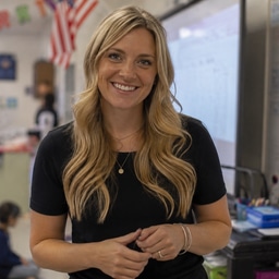 Ms. Bennett, Carson’s teacher, smiling in her classroom.